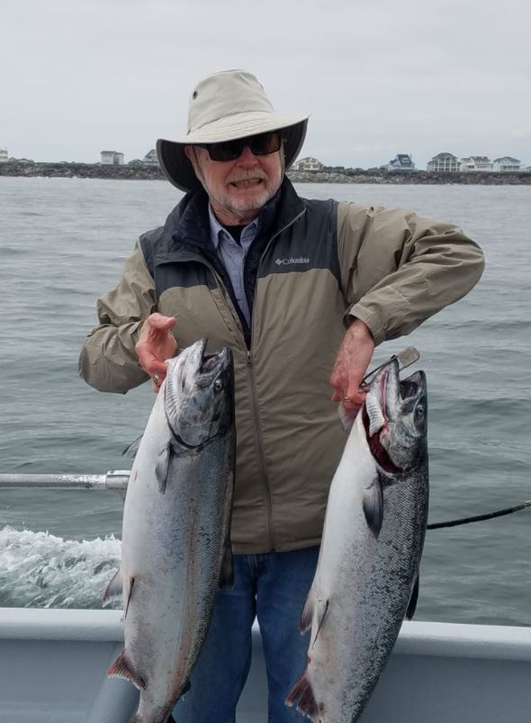 Quartermaster Rodenberger with his salmon catch.