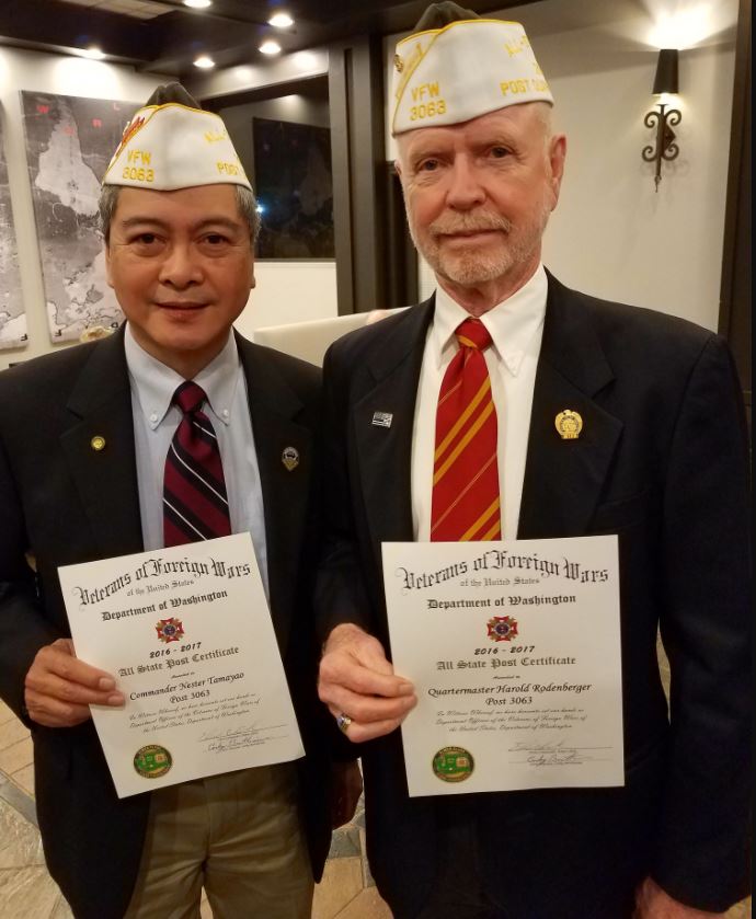 Nestor Tamayao and Harold Rodenberger wear their newly-awarded “White Hats.”