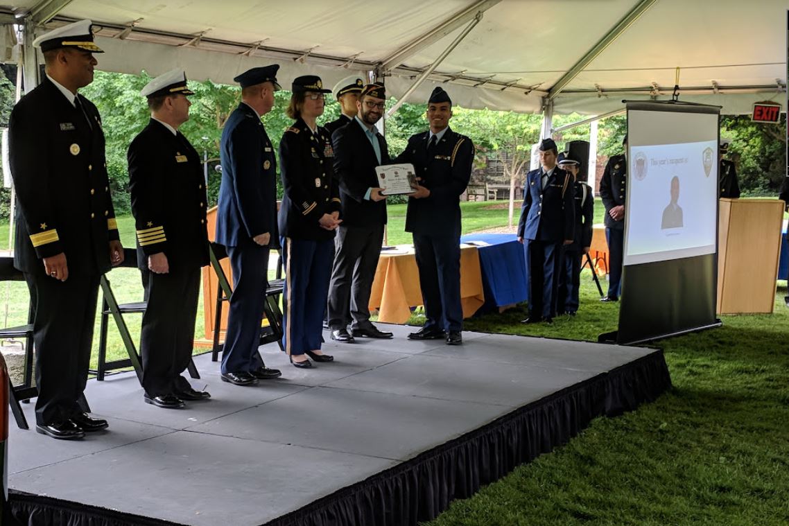 Post Commander Krawitz presents award to Cadet Lowery.