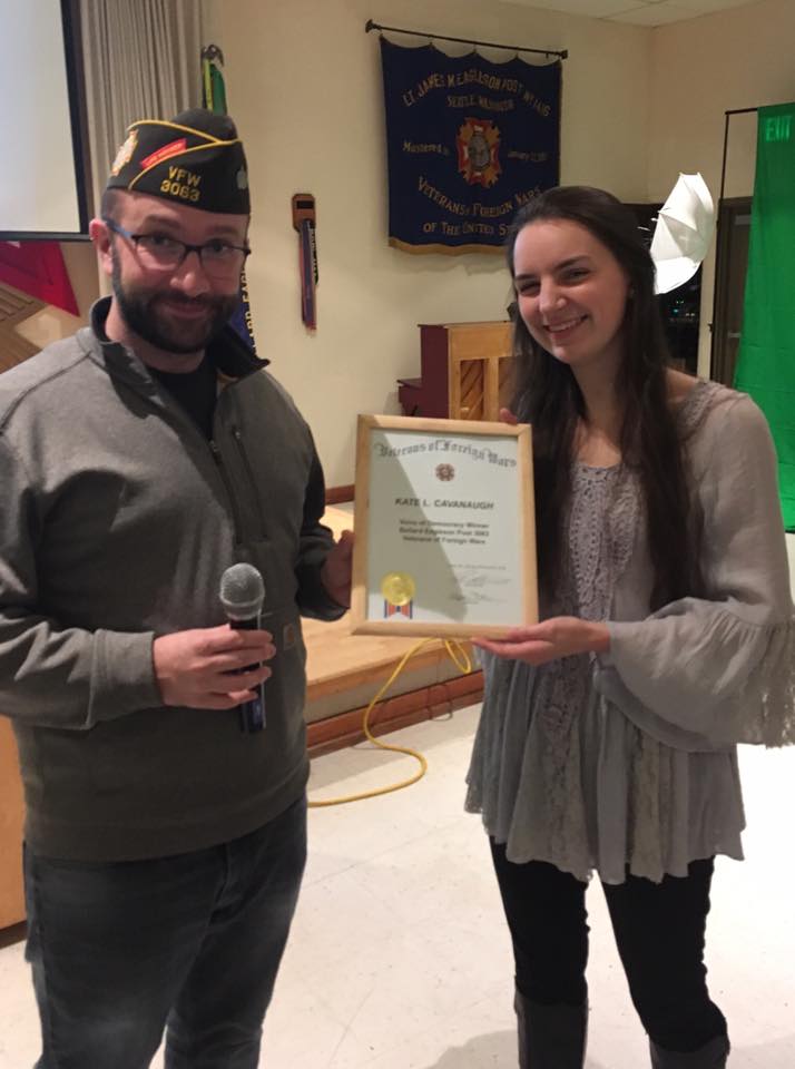 Commander Krawitz presents a certificate to Kate at the December Business Meeting. 
