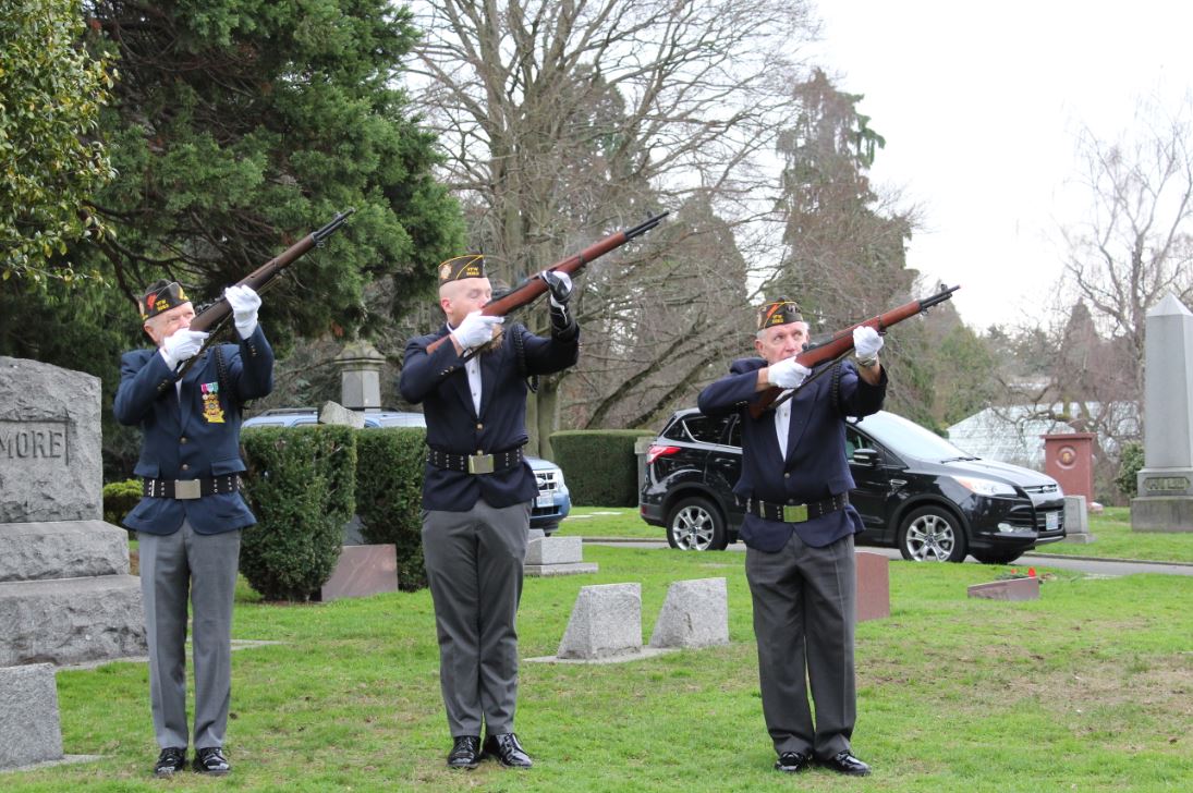 Post 3063 Honor Guard members perform 21-gun salute.