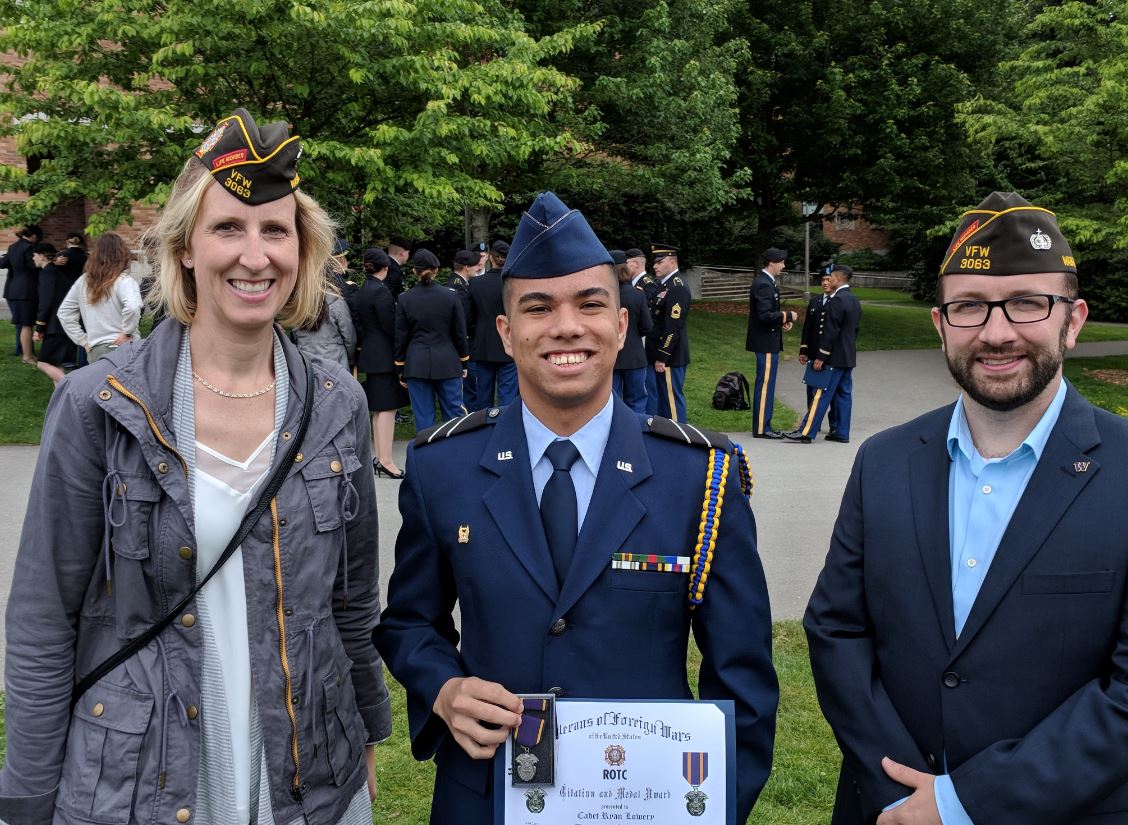 Post 3063 Adjutant Alyson Teeter (2002 Det 910 Alumnus) and Commander Pete Krawitz pose with Cadet Ryan Lowery.