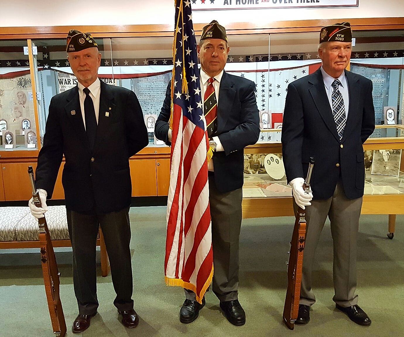 From left, Harold Rodenberger, Joe Fitzgerald, and Bill Hoeller in color guard formation for the UW event.