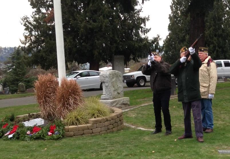 The Honor Guard fires volleys during the Wreaths Across America ceremony.